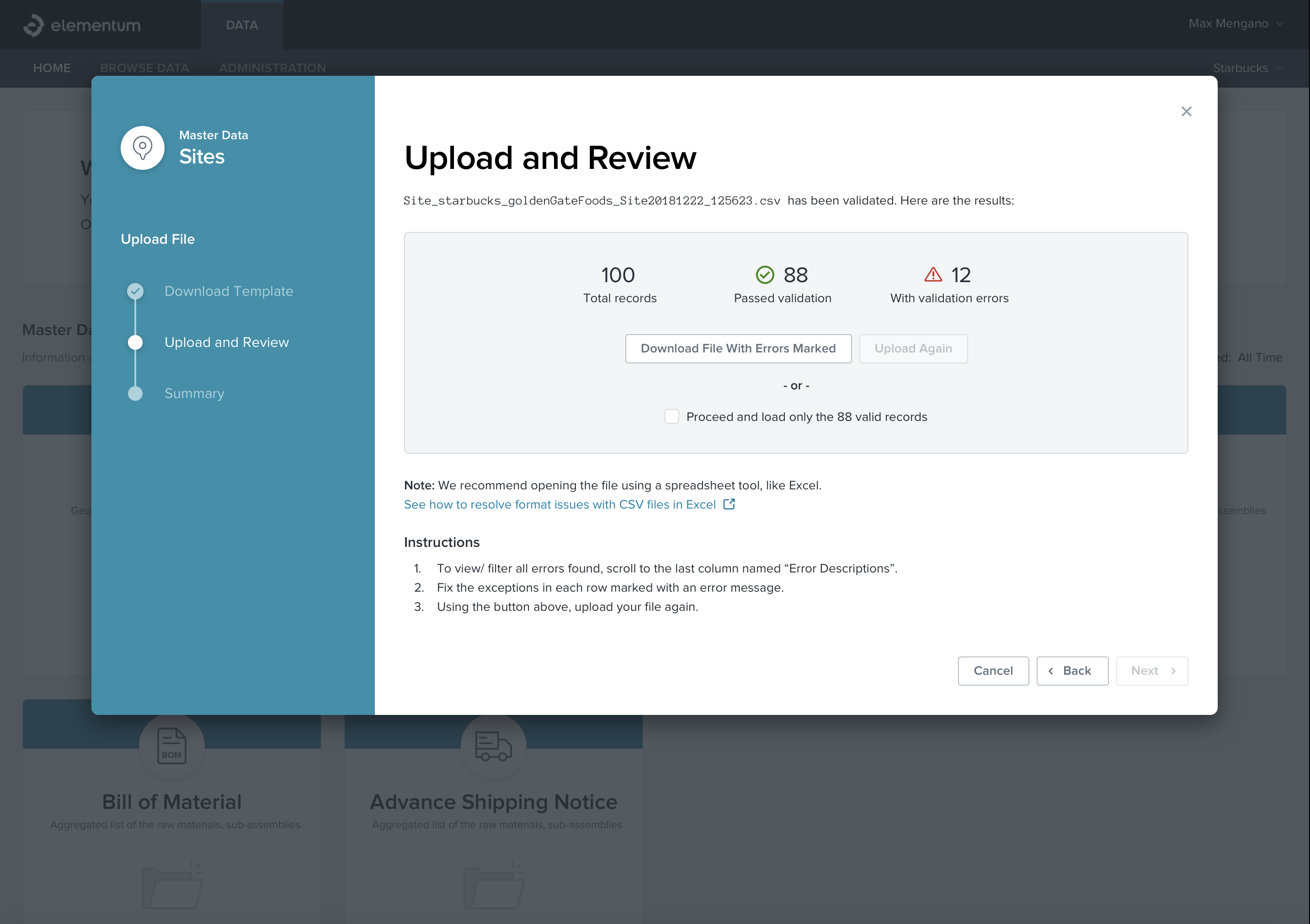 two people sitting on a ledge talking